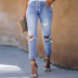 muchos agujeros desgastados en los nuevos jeans de nueve puntos de cintura alta para mujeres NSSI2748