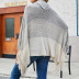 half-open collar hit color tassel cloak shawl sweater nihaostyles wholesale clothing NSMMY83159