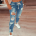 Jeans adelgazantes rotos con cordones NSWL97557