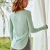 solid color long-sleeved tight arc hem fitness blouse NSMYM54143