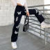 Mujeres sueltas de cintura alta con estampado de mariposas jeans nihaostyles ropa al por mayor NSXPF75159