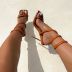 sandalias de tacón de aguja con patrón de punta abierta para mujer nihaostyles ropa al por mayor NSCA77522