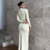 solid color irregular high-neck long-sleeved hollow dress NSMG138779