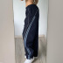Pantalones tejidos con cintura elástica a rayas de color en contraste NSGXF139330