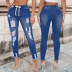 jeans rasgados de corte slim con cordones NSWL118983