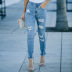 jeans slim con cintura media y rotos NSSI118050