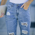 jeans slim con cintura media y rotos NSSI118050