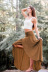 falda de cintura alta con volantes en color liso y dobladillo irregular NSMID128652