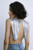 Conjunto de falda y chaleco de color liso sin mangas y sin espalda con lentejuelas metálicas NSXYA132160