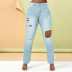 jeans slim con cintura alta y rotos NSWL135038